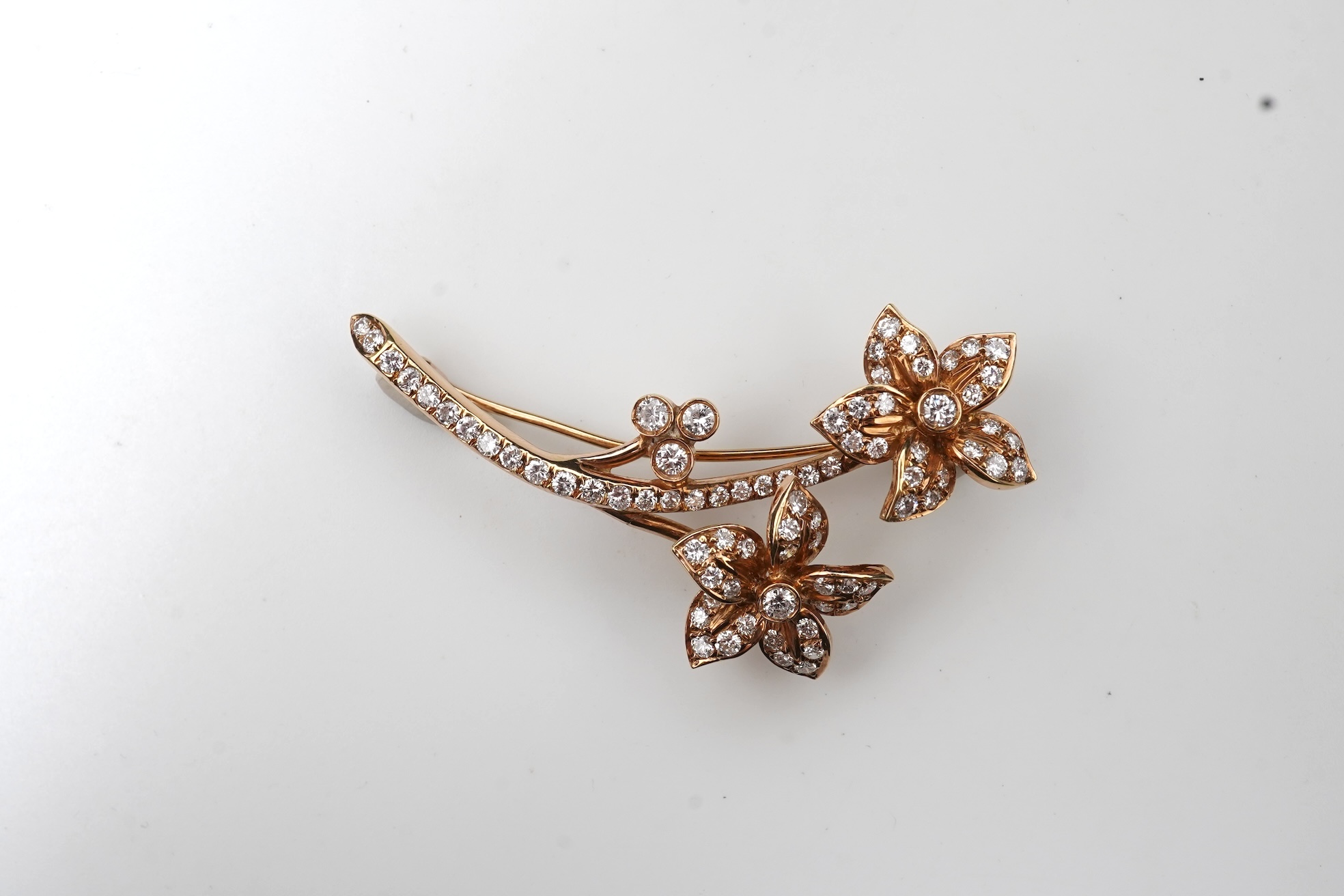 A gold and diamond brooch